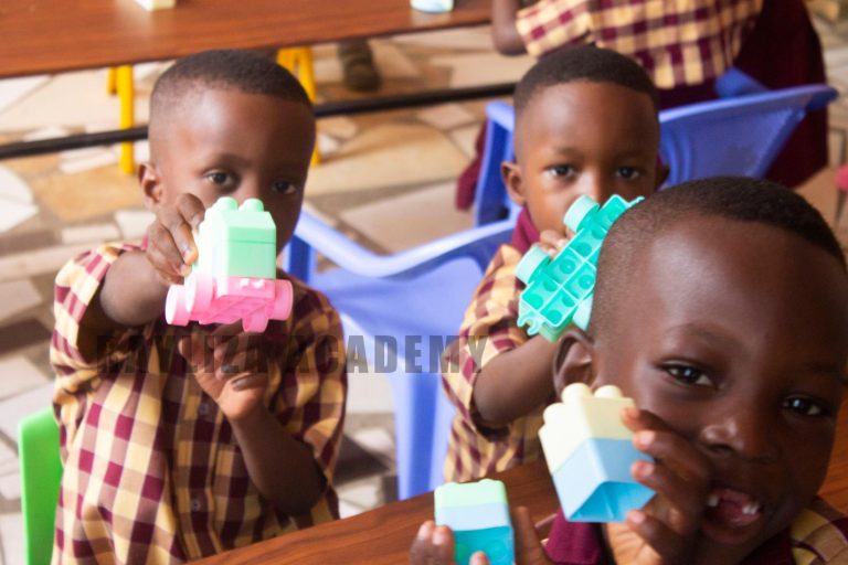 Young learners playing with colourful building blocks